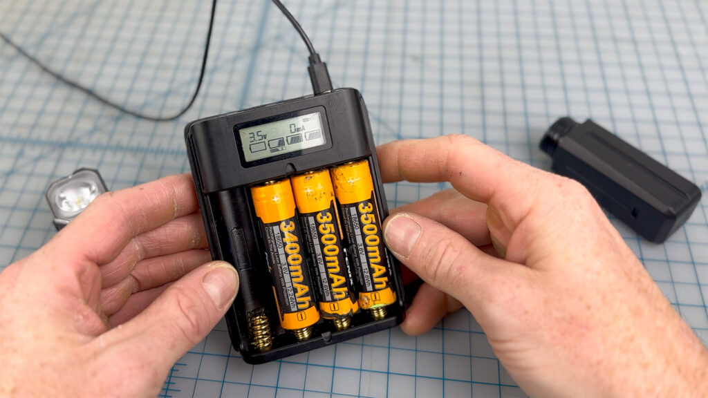 An array of 18650 batteries in a charger (charger sold separately).