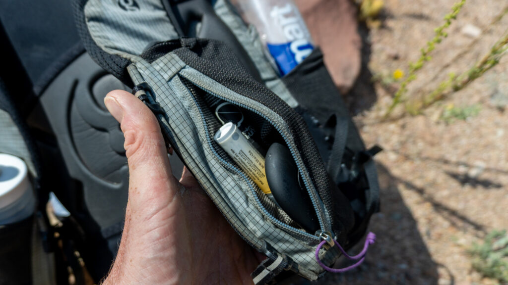 The left front pocket is zippered and perfect for small items that you use all the time, like chapstick, sunscreen, or hand sanitizer
