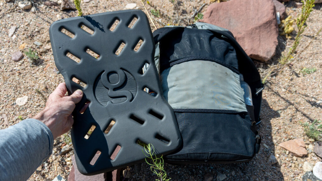 The back foam padding can be removed to be used as a sit pad or to lay on for a quick nap