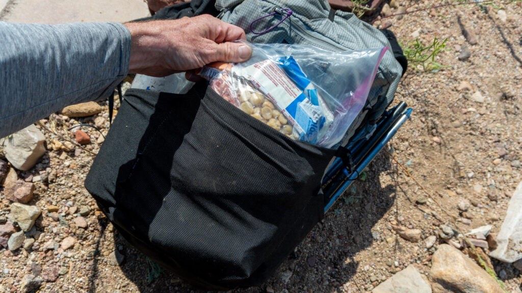 The center pocket easily swallows up a day's ration stored in a gallon ziplock back, with a little but more room for other items