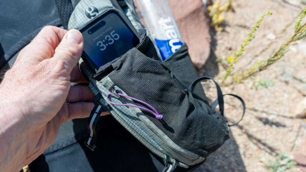 I usually put my large iPhone in the left back pocket, in back of the zippered pocket